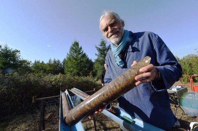 Astrogeologist Philippe Lambert holds a sample of a rock extracted from the original base of the meteorite impact crater on October 17, 2017 in Rochechouart. Mehdi Fedouach/AFP