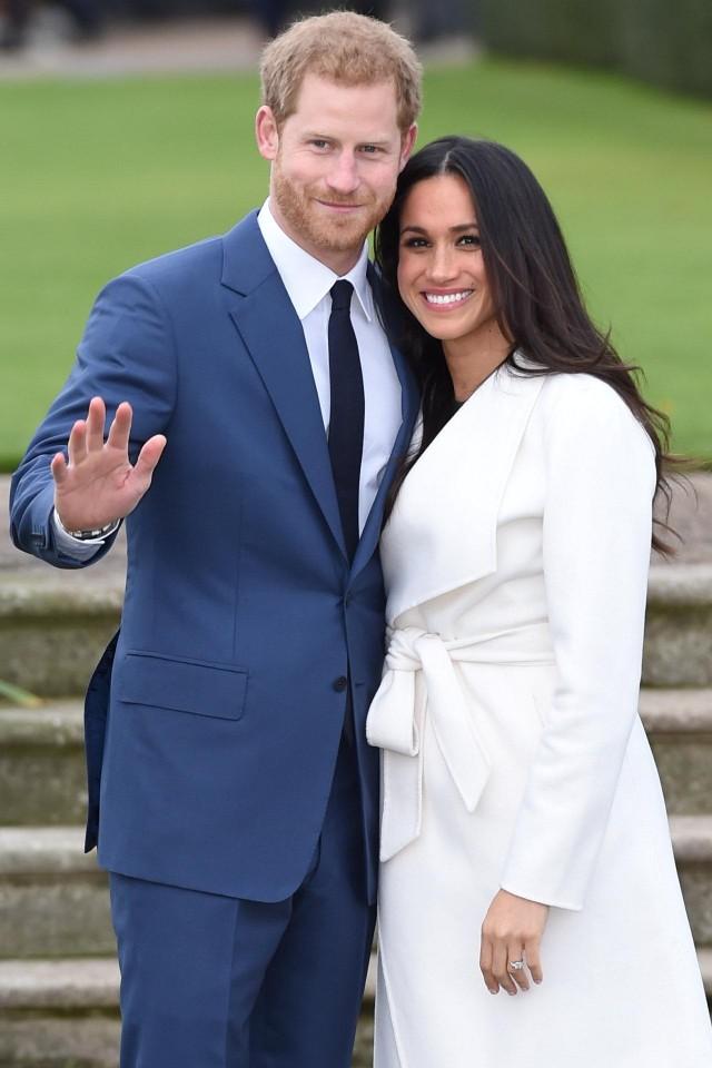 Britain's Prince Harry poses with Meghan Markle in the Sunken Garden of Kensington Palace, London, Britain, November 27, 2017. REUTERS/Eddie Mulholland/Pool