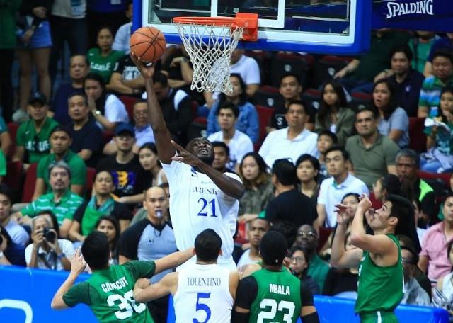  Chiz Ikeh of Ateneo goes for a one handed shot during their game 1 Finals in the UAAP Season 80 Basketball Tournament in MOA Arena on Saturday. Photo: KC Cruz