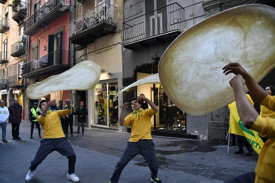 Members of the Pizzaioli Acrobats Coldiretti perform 