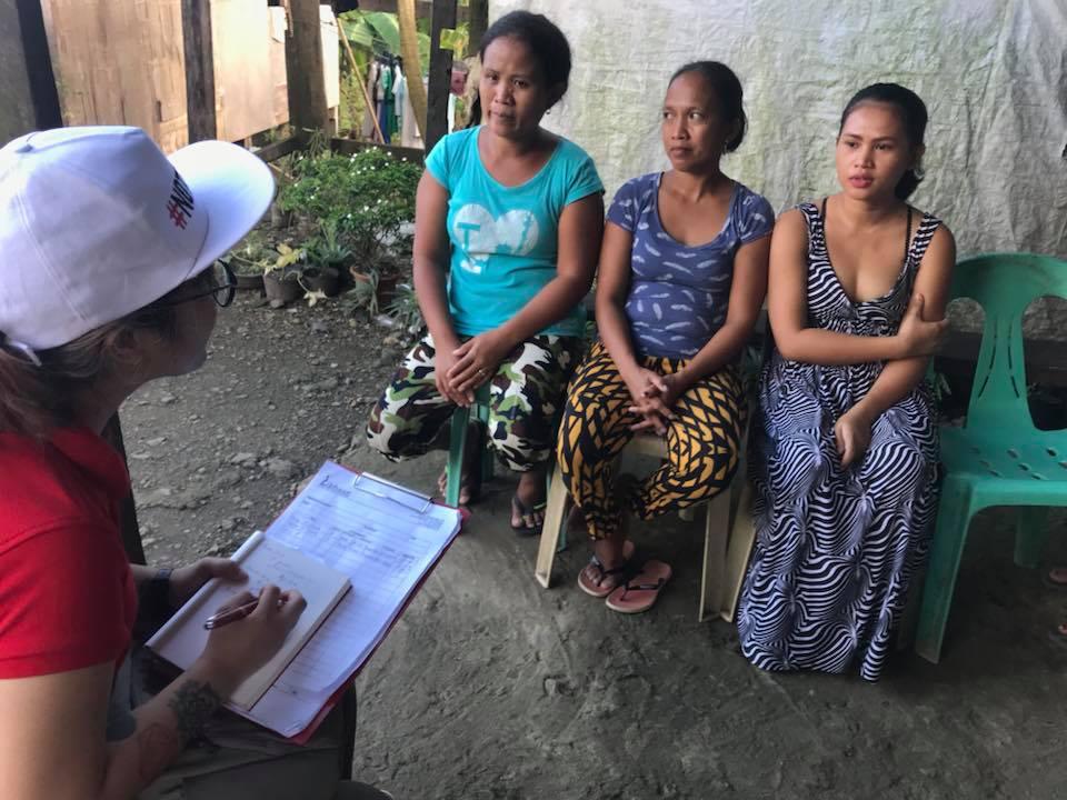 Shirlita (center) says that the monthly visits conducted by health workers help educate not just her, but her husband and children as well. She is now a community health leader. Photo: Aya Tantiangco