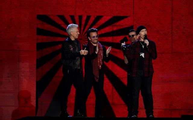 Irish group U2 receive an award at the 2017 MTV Europe Music Awards at Wembley Arena in London, Britain, November 12, 2017. REUTERS/Dylan Martinez