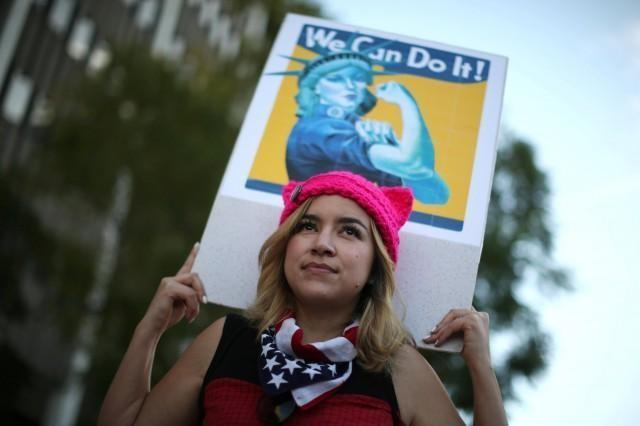 Kat Bembi, 35, participates in the International Women's Day "Day Without a Women" anti-Trump protest in Los Angeles, California, U.S., March 8, 2017. REUTERS/Lucy Nicholson.