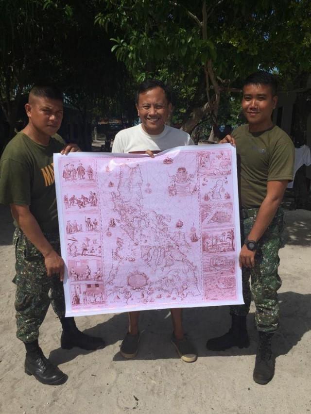 The author turns over a copy of the 1734 Murillo Velarde map to the Marines guarding Panguan Island.