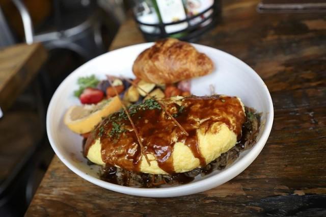 Kitchen Story offers California cuisine with Asian influences. Breakfast and brunch options include Ribeye Omurice, eggs, oatmeal, and bottomless Mimosa.