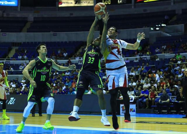 June Mar Fajardo of SMB and Kelly Nabong of Global port battles for the rebound during their game in the 43rd PBA Philippine Cup in Araneta Coliseum on Wednesday. PHOTO BY KC Cruz