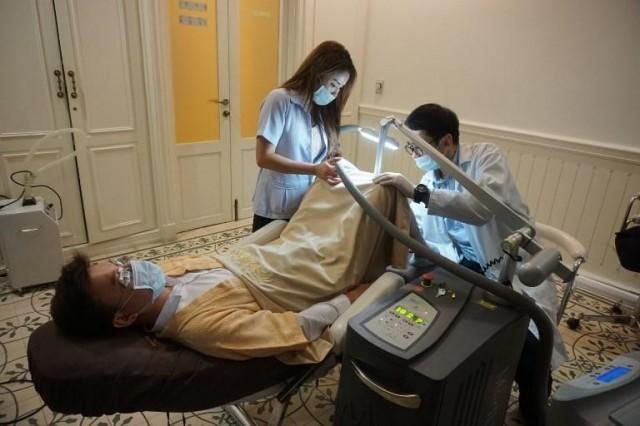 This promotional handout from 2016 and received by AFP on January 4, 2018 from Lelux Hospital shows a man undergoing a penis whitening procedure at the Bangkok branch of Lelux Hospital. Handout / LELUX HOSPITAL / AFP