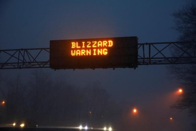 A sign reading Blizzard Warning is seen above the Northern State Parkway near Westbury, New York, U.S. January 4, 2018. REUTERS/Shannon Stapleton
