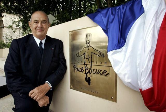 French world renowned chef Paul Bocuse, poses in front of a commemorative plaque, during the inauguration of the Fondation Paul Bocuse, in Ecully, near Lyon, France, June 3, 2004. Paul Bocuse has died, January 20, 2018, aged 91. Picture taken June 3, 2004. REUTERS/Robert Pratta/File Photo