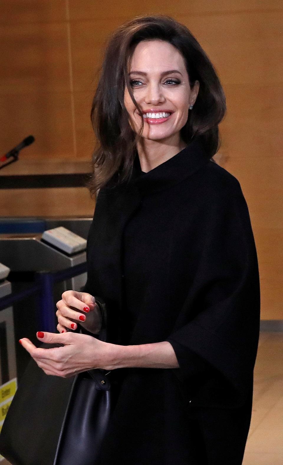 UNHCR Special Envoy Angelina Jolie waves after a news conference at NATO headquarters in Brussels, Belgium, January 31, 2018. REUTERS/Yves Herman