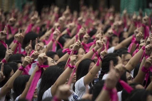 More than 3,000 students participated as part of the campaign, calling for an end of all forms of discrimination and violence against women and children. Ted Aljibe/AFP