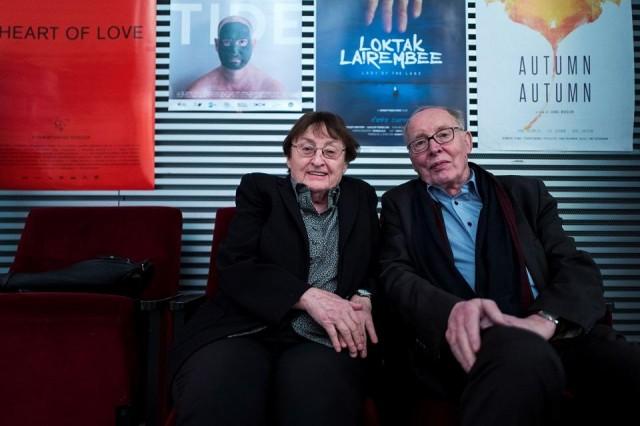 German married couple Erika and Ulrich Gregor pose in the lobby of a movie theater in Berlin in this photo taken on February 8, 2018. It's a love that was born in a cinema in 1950s Cold War Berlin and that's been nourished for over six decades by at least a movie a day together. John MacDougall/AFP