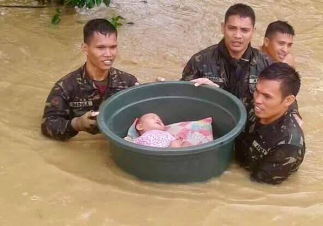 Soldiers rescue a five-month old infant who was placed inside a basin in Surigao City. PHOTO BY 30TH INFANTRY PYTHON BATTALION, PHILIPPINE ARMY
