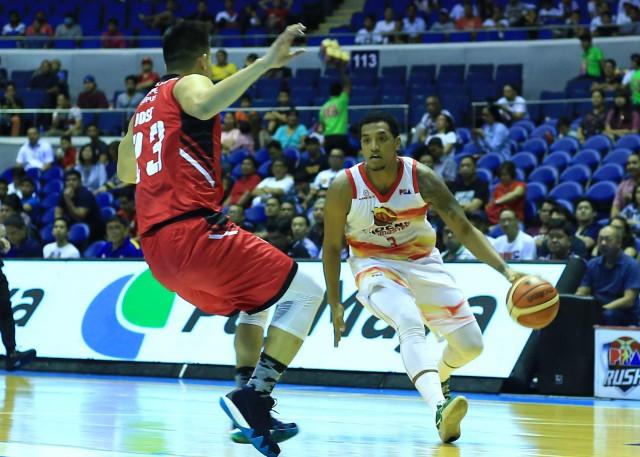Jason Perkins of Phoenix tries to pass the defense of Reymar Jose of Blackwater during their game in the 43rd PBA Philippine Cup in Araneta Coliseum on Wednesday. PHOTO BY KC Cruz