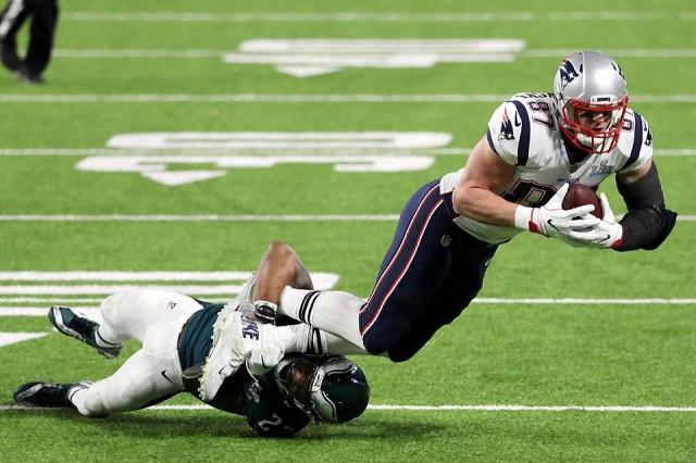New England Patriots tight end Rob Gronkowski (87) is tackled by Philadelphia Eagles free safety Rodney McLeod (23) during the first half of their game in Super Bowl LII at US Bank Stadium in Minneapolis, MN on Sunday, February 4, 2018. Reuters/Brace Hemmelgarn-USA TODAY Sports