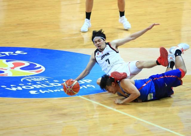 Gilas Pilipinas guard Kiefer Ravena dives for the ball against Japan in their FIBA Basketball World Cup qualifier on Sunday, February 25, 2018