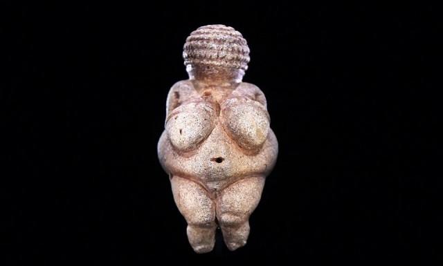 This undated picture released on February 28, 2018 shows the prehistoric Venus of Willendorf figurine, considered a masterpiece of the paleolithic era, pictured at the Nature Historical Museum in Vienna, Austria. Helmut Fohringer/APA/AFP