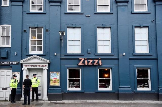 A police officer stands outside a restaurant which was closed after former Russian inteligence officer Sergei Skripal, and a woman were found unconscious on a bench nearby after they had been exposed to an unknown substance, in Salisbury, Britain, March 6, 2018. REUTERS/Toby Melville