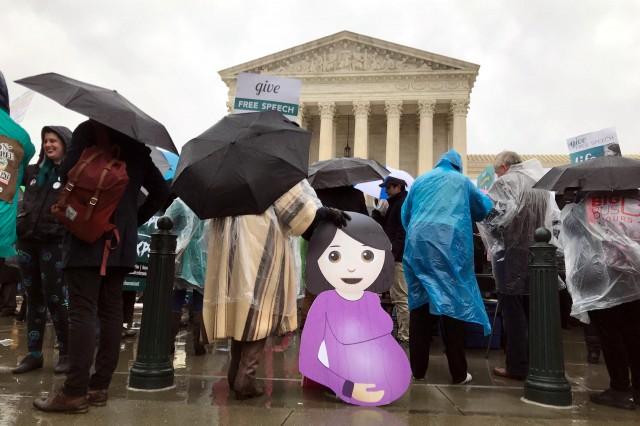 Opponents of a California law, requiring anti-abortion pregnancy centers to post signs notifying women of the availability of state-funded contraception and abortion, hold a rally in front of the U.S. Supreme Court in Washington, U.S., March 20, 2018. REUTERS/Andrew Chung