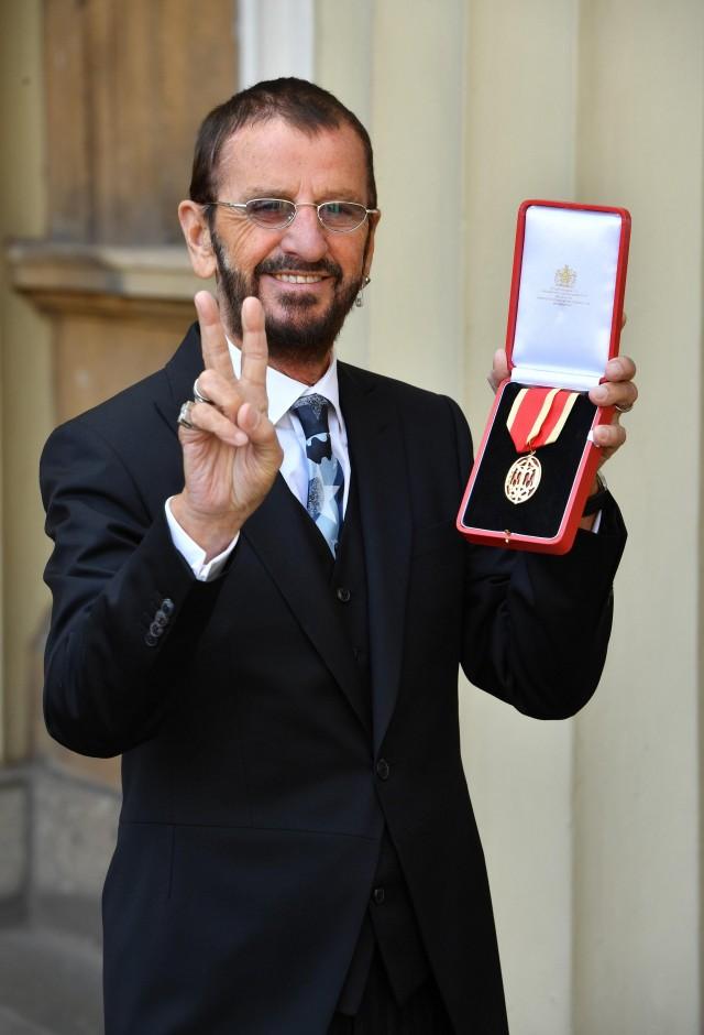Ringo Starr, whose real name is Richard Starkey, poses after receiving his Knighthood at an Investiture ceremony at Buckingham palace in London, Britain, March 20, 2018. John Stillwell/Pool via Reuters