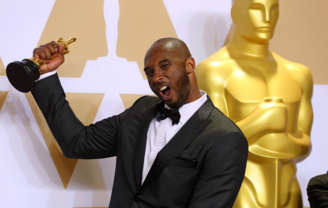 Kobe Bryant with Best Animated Short Film Award for "Dear Basketball". REUTERS/Mike Blake