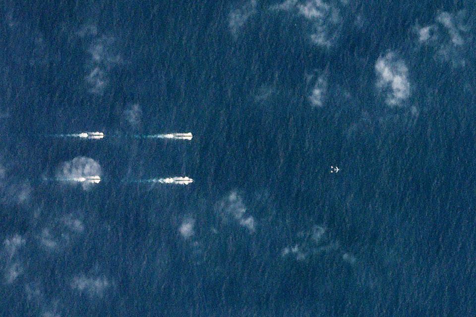 A satellite photo dated March 26, 2018 shows Chinese ships south of Hainan, China. Planet Labs/Handout via Reuters 