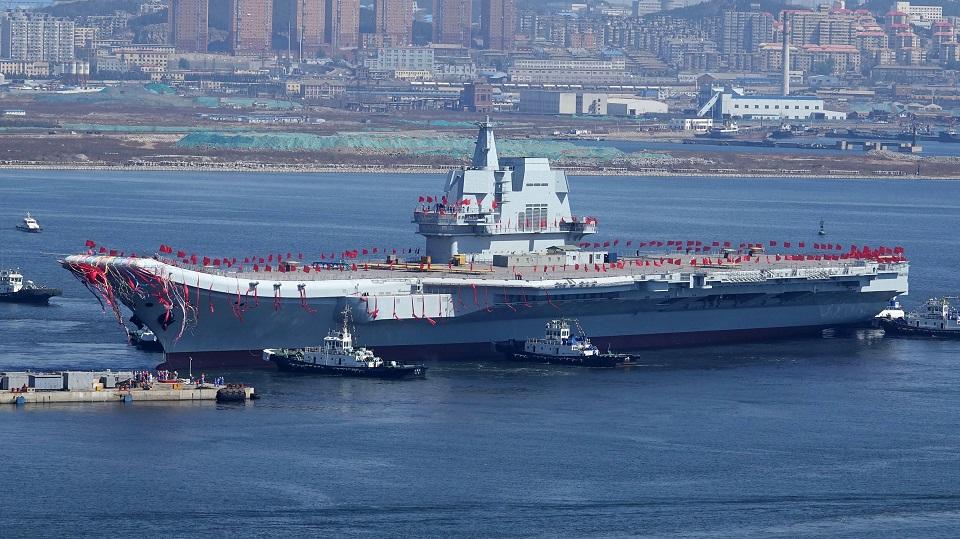 Type 001A, China's second aircraft carrier, is transferred from the dry dock into the water during a launch ceremony at Dalian shipyard in Dalian, northeast China's Liaoning Province, April 26, 2017. China launched its first domestically designed and built aircraft carrier, state media said, as the country seeks to transform its navy into a force capable of projecting power onto the high seas. STR/AFP