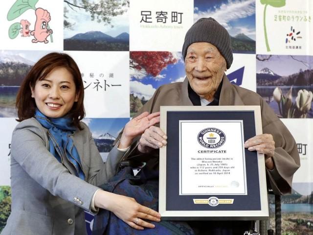 Japanese Masazo Nonaka, who was born 112 years and 259 days ago, receives a Guinness World Records certificate naming him the world's oldest man during a ceremony in Ashoro, on Japan's northern island of Hokkaido, in this photo taken by Kyodo April 10, 2018. Kyodo/via REUTERS