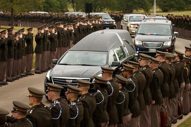 The hearse carrying former first lady Barbara Bush passes through members of the Texas A&M Corps of Cadets as it nears her husband's presidential library at the university in College Station, Texas, April 21, 2018. Smiley N. Pool/Pool via REUTERS
