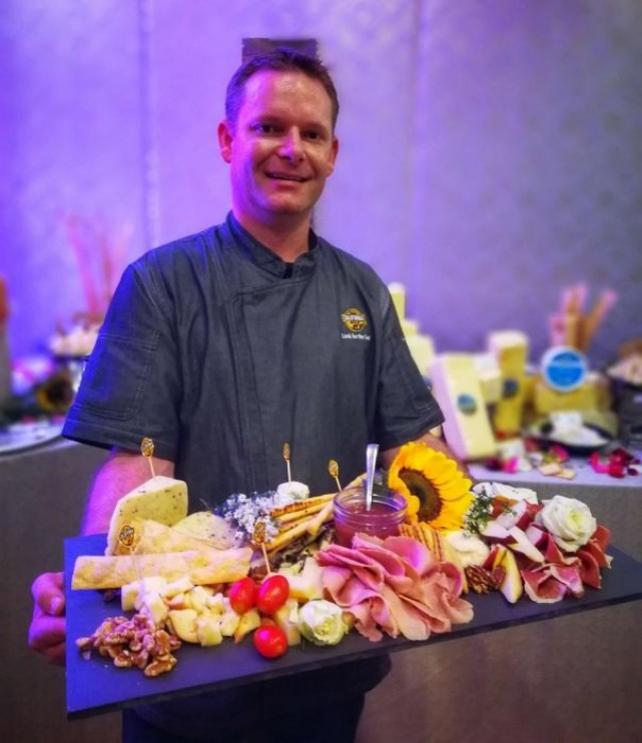 Joe Baird, a cheese expert of California Milk Advisory Board, says cheese boards are very outgoing and easy to prepare.