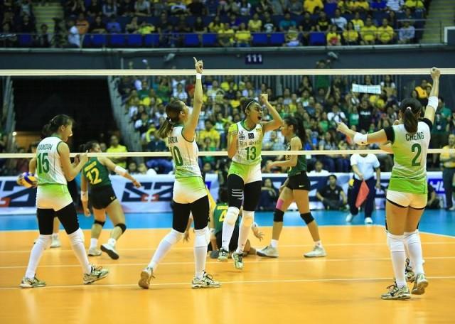 DLSU lady spikers celebrates as they get a point during their game 1 Finals in the UAAP Women's Volleyball match againsts FEU Lady Tamaraws in Araneta Coliseum on Sunday.