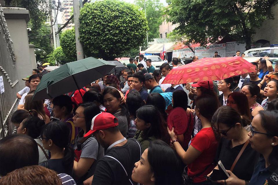 Law graduates who took the Bar exams in November last year gather in front of the Supreme Court on Thursday, April 26, 2018, for the official announcement of the exam results. Nicole-Anne C. Lagrimas