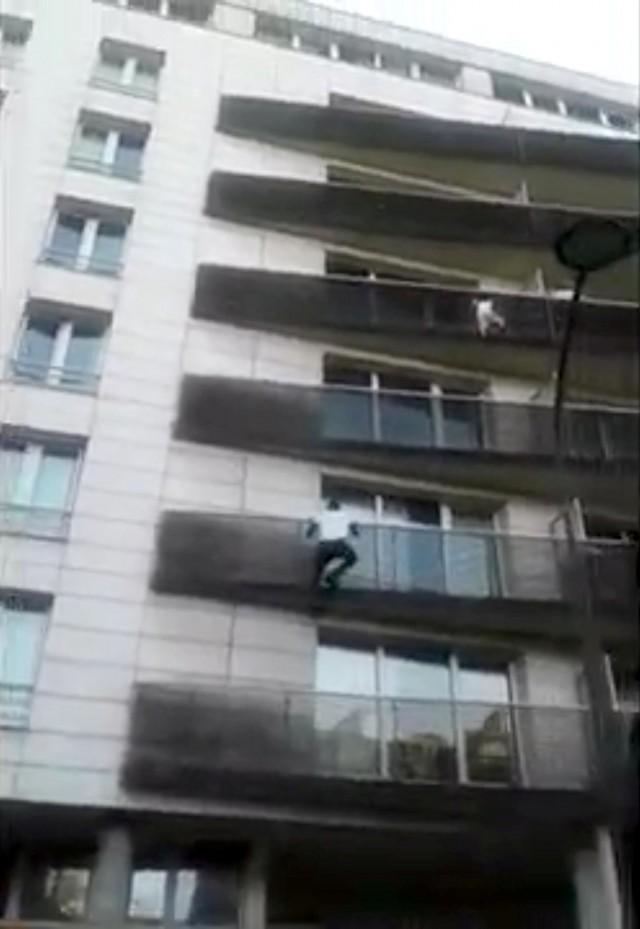 Mali immigrant rescues dangling child from balcony in Paris, France, in this May 26, 2018 still image obtained May 28, 2018 from social media video. TAREK DANDACH/via REUTERS