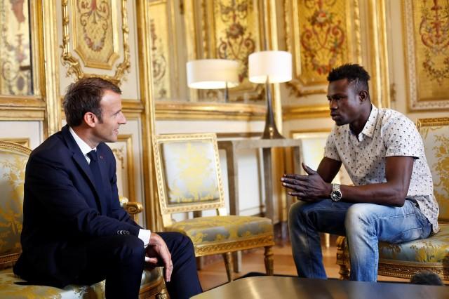 French President Emmanuel Macron (L) meets with Mamoudou Gassama, 22, from Mali, at the Elysee Palace in Paris, France, May 28, 2018. Thibault Camus/Pool via Reuters