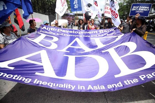 Members of civil society groups and communities launch a protest action against Asian Development Bank outside the ADB headquarters on its 51st Annual Meeting on Thursday, May 3, 2018. The protesters demand that the financial institution be held accountable for its continuous push for alleged anti-development strategies across Asia and the Pacific. GMA News