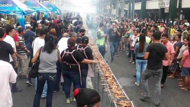 About 3,000 pieces of chicken inasal were prepared in the 300-meter grill which revelers partook for free! Photo: Erwin Nicavera