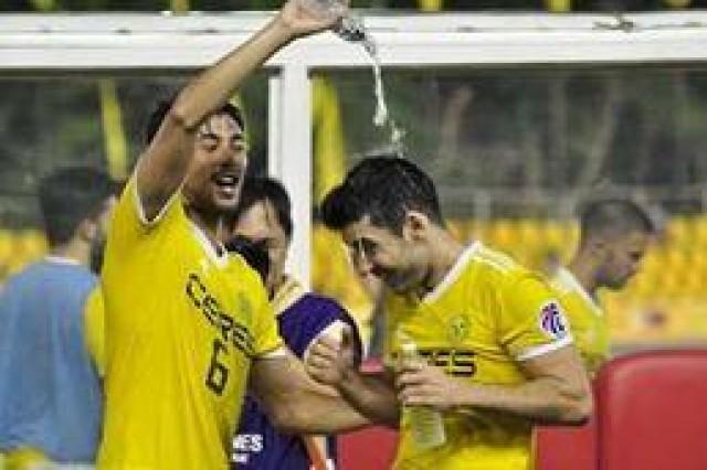 Man of the match Bienvenido MaraÃ±on (right) and other Ceres Negros FC players celebrate as they win the match against Davao Aguilas FC held at Panaad Park and Stadium in Bacolod City Wednesday night. Photo: Merlinda Pedrosa