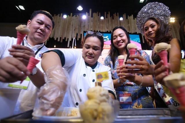 Bicolano ice cream makers Elmer and Rowena Aspe, show off their newest ice cream flavor: the Carmelado at the IFEX( Intl Food Exhibition) in the World Trade Center in Pasay City on Sunday, May 27, 2018. Photo: Danny Pata