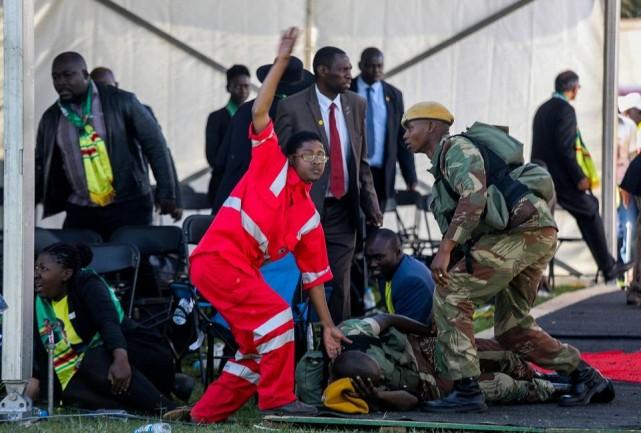 Medics attend to people injured in an explosion during a rally by Zimbabwean President Emmerson Mnangagwa in Bulawayo, Zimbabwe June 23, 2018. Tafadzwa Ufumeli/via REUTERS