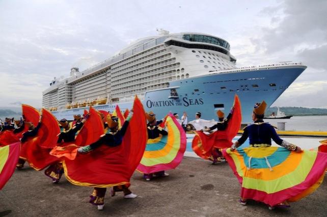 Dancers in colorful costume provide welcome gaiety at Alava Wharf during the arrival of MS Ovation of the Seas, a Royal Caribbean International cruise ship, which made its maiden port call in the Subic Bay Freeport on Friday, June 8.
