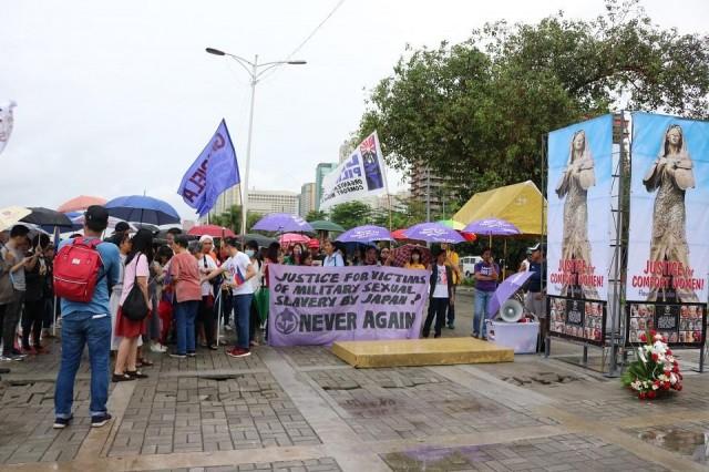 Women's groups accuse the Duterte administration of succumbing to pressure from other nations, on the site where the statue of a comfort woman once stood on Roxas Boulevard in Manila on Tuesday, June 12, 2018. Photo: Aya Tantiangco