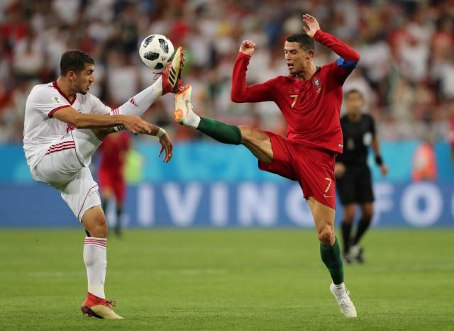 World Cup - Group B - Iran vs Portugal - Mordovia Arena, Saransk, Russia - June 25, 2018 Iran's Majid Hosseini in action with Portugal's Cristiano Ronaldo REUTERS/Ivan Alvarado