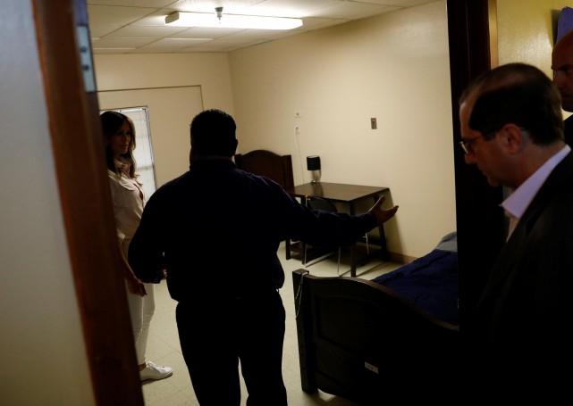 U.S. first lady Melania Trump visits a room as Health and Human Services Secretary Alex Azar (R) looks on during a tour of the Lutheran Social Services of the South "Upbring New Hope Children's Center" near the U.S.-Mexico border in McAllen Texas, U.S., June 21, 2018. REUTERS/Kevin Lamarque