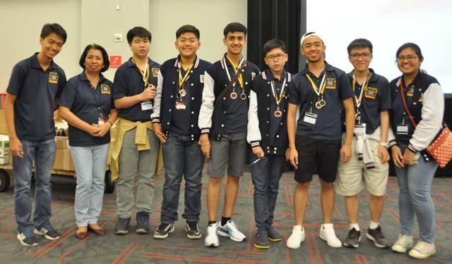 From left to right) : Charles Kyle Mupas, Rechilda Villame (Team Leaders), Individual Top Scorers: William Joshua King, Hans Mackenzie Uy, Bikram Chohan Singh, Arthur Caleb Co, John Joshua Cruz, Lance Adrian Ko , Ezra Templonuevo (Team Leader). (Not in photo: Kirk Patrick Bamba)