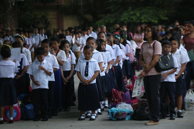 Grade 4 pupils of Dr. Alejandro Albert in Sampaloc, Manila, start the opening of the school year 2018-2019 with a prayer.