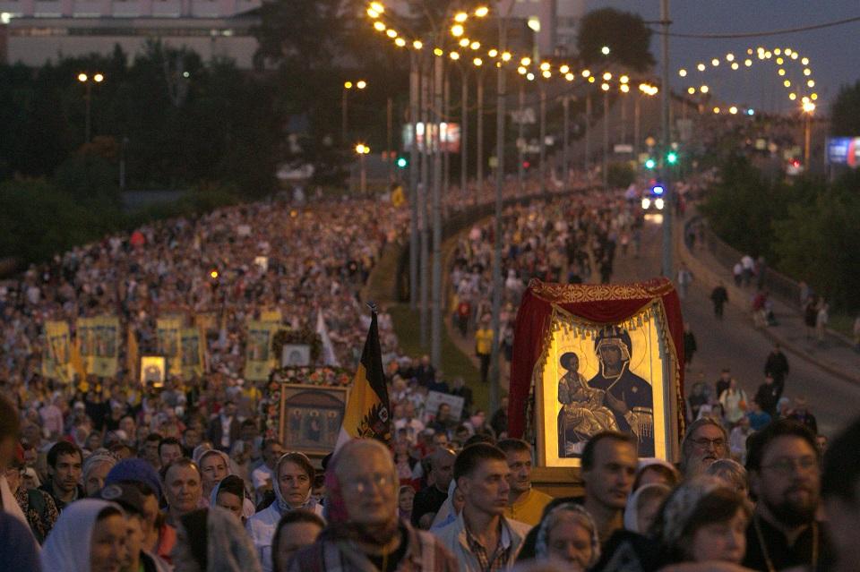Russian Orthodox believers take part in a nighttime procession marking 100 years since the Bolsheviks shot dead tsar Nicholas II and his family after he abdicated outside Yekaterinburg early on July 17, 2018. Vlad Lonshakov/AFP