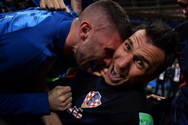 Croatia's forward Mario Mandzukic (R) celebrates with teammates after scoring his team's second goal during the Russia 2018 World Cup semi-final football match between Croatia and England at the Luzhniki Stadium in Moscow on July 11, 2018. Yuri Cortez/AFP
