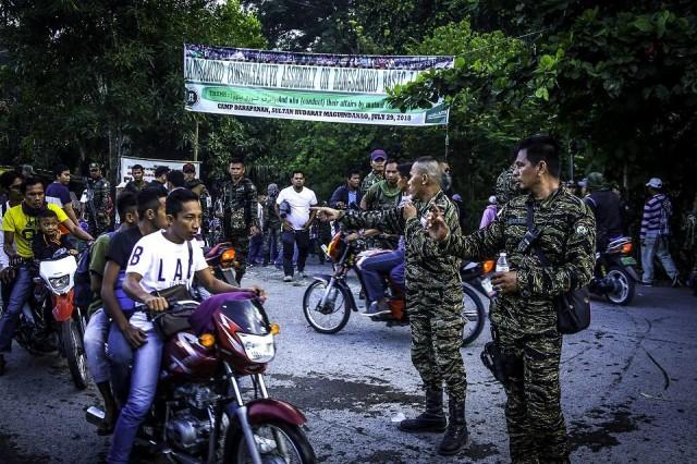 Moro Islamic Liberation Front (MILF) members secure Camp Darapanan in Sultan Kudarat, Maguindanao on the southern island of Mindanao on July 29, 2018. Nearly 100,000 members and supporters gathered on July 29 to discuss the Bangsamoro Organic Law, expressing hope it would make their "dream of peace" a reality. Ferdinandh Cabrera/AFP