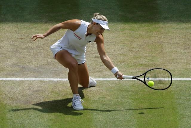 All England Lawn Tennis and Croquet Club, London, Britain - July 12, 2018 Germany's Angelique Kerber in action during her semi final match against Latvia's Jelena Ostapenko Ben Curtis/Pool via Reuters