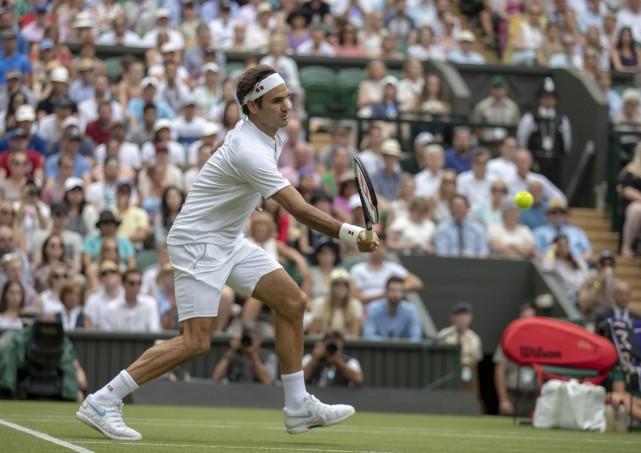 Roger Federer (SUI) in action during his match against Lukas Lacko (SVK) on day three at the All England Lawn and Croquet Club. Mandatory Credit: Susan Mullane-USA TODAY Sports